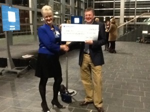 Glenda Hill of Wrexham Maelor Hospital receiving a cheque from our Treasurer Rob.